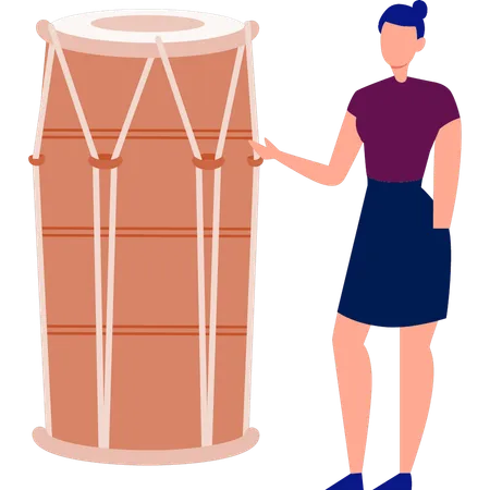 Woman pointing at Dholki  Illustration