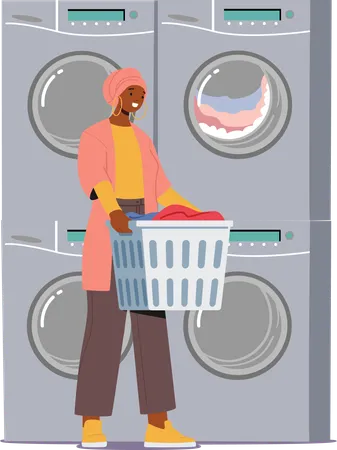 Woman Stands In A Public Laundry Amidst The Hum Of Laundromat Machines She Holds Basket With Clothes Concept Of Clothing Care Everyday Routine And Cleaning Service Cartoon Vector Illustration Illustration