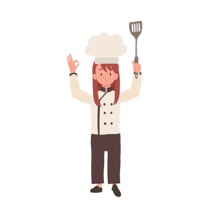 Young Chef Showing OK Sign Happy Chef Doing OK Hand Sign And Holding Flipper In Other Hand Illustration