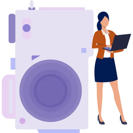 Young lady holding laptop while transfer photo from camera  Illustration