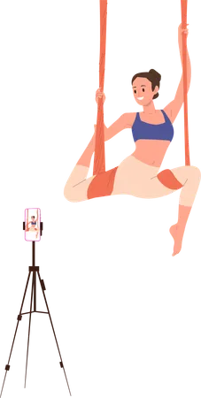 Young sportswoman doing aerial yoga recording video tutorial for blog on phone  Illustration